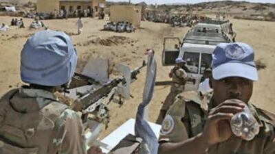South African soldiers serving with the United Nations African Union Mission in Darfur patrol near the village of Kafod in North Darfur, Sudan.