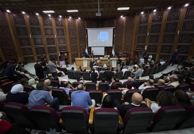 Candidates attend a count in the coastal city of Latakia on Sunday. AP