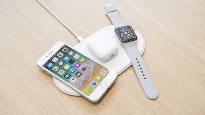 The Apple Inc. iPhone 8, Airpods, and Apple Watch sit on the AirPower charger during an event at the Steve Jobs Theater in Cupertino on Tuesday, September 12, 2017. David Paul Morris / Bloomberg