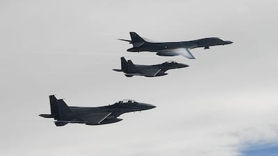 A US Air Force B-1B Lancer bomber (Top) fly with South Korean jets over the Korean Peninsula during a South Korea-US joint live fire drill on July 8, 2017 in Korean Peninsula, South Korea. South Korean Defense Ministry / Getty Images