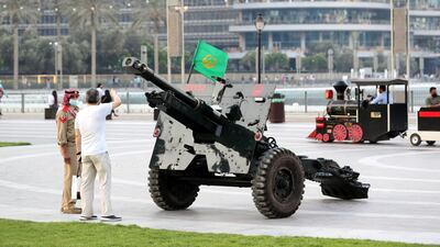 Dubai Police prepare to the Eid Al Fitr cannon to mark end of Ramadan at Burj Khalifa. Chris Whiteoak / The National.