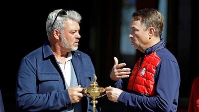 Europe captain Darren Clarke, left, and United States captain Davis Love III pose with the Ryder Cup Monday, September 26, 2016, at Hazeltine National Golf Club in Chaska, Minn. David J Phillip / AP Photo