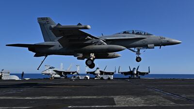 An FA-18 Hornet fighter jet lands on the deck of the 'USS Harry S Truman' during a Nato exercise in the Eastern Mediterranean. AFP