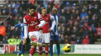 Arsenal's Mikel Arteta scores from the penalty spot. Clive Brunskill / Getty Images