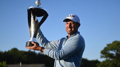 Charl Schwartzel poses with the trophy after winning the LIV Golf Invitational Series at the Centurion Golf Club in St Albans. EPA