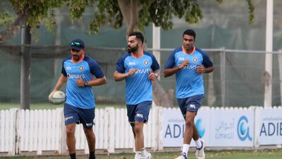Virat Kohli and teammates train at the ICC Academy.