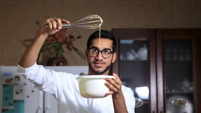 The Emirati baker Bader Najeeb Al Awadhi prepares a batch of vanilla pastry cream for an order of eclairs at his home in Dubai, Sarah Dea /The National