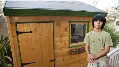Salman Rouhani, 13, with an Out of The Box shed in his parents' garden in Dubai.