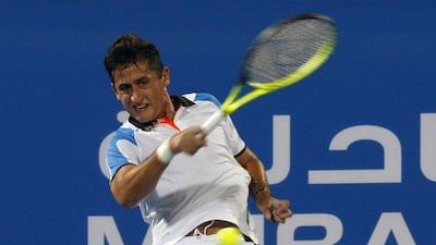 Nicolas Almagro returns a shot during his loss to Stan Wawrinka in the Mubadala World Tennis Championship in Abu Dhabi on Thursday night. Martin Dokoupil / Reuters