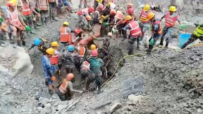 A survivor is carried to safety at a tunnel in the Rasuwa district. Reuters