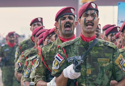 Iraqi Army troops in Baghdad take part in a ceremony marking the eighth anniversary of the defeat of ISIS as a cohesive military force. AP