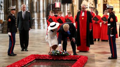 US President Donald Trump and First Lady Melania Trump lay a wreath at the Grave of the Unknown Warrior during their visit to Westminster Abbey in London, England. Getty Images