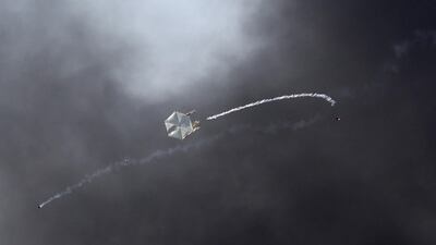 A Molotov cocktail kite is seen flying over the Israeli side of the border as thousands of Palestinian demonstrators gather near the border fence between Gaza and Israel, in southern Israel, 08 June 2018. Palestinians mark the Naksa Day, Al Quds Day (Jerusalem Day) and the last Friday prayer of the holy month of Ramadan. Abir Sultan / EPA