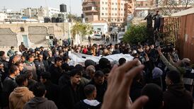 Palestinians mourn relatives and friends during a funeral service at Nasser Hospital in Khan Younis. EPA