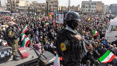 A police officer stands guard as funerals are held for members of Iran's Revolutionary Guards Corps (IRGC) and other military figures at Enghelab Square on March 11, 2026 in Tehran, Iran. Getty Images