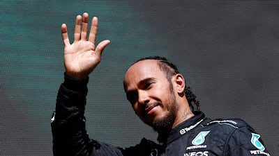 Mercedes' British driver Lewis Hamilton waves as he arrives for the podium ceremony after the Formula One Belgian Grand Prix at the Spa-Francorchamps Circuit in Spa on July 28, 2024. (Photo by SIMON WOHLFAHRT / AFP)