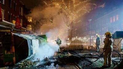 Firefighters work to extinguish a fire on the Groene Hilledijk in Rotterdam. AFP