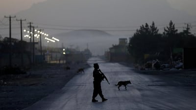 A police officer keeps guard near the site of a truck bomb attack in Kabul, Afghanistan. Mohammad Ismail / Reuters