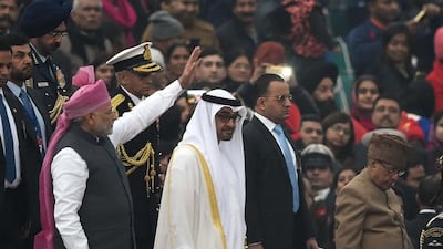 Indian prime minister Narendra Modi waves as he leaves with Sheikh Mohammed bin Zayed, Crown Prince of Abu Dhabi and Deputy Supreme Commander of the Armed Forces, and Indian president Pranab Mukherjee after the Republic Day Parade at Rajpath in New Delhi on Thursday. Prakash Singh / AFP
