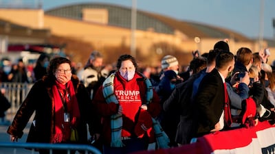Supporters of US President Donald Trump gather at Joint Base Andrews in Maryland for Trump's arrival. AFP