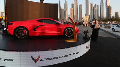 A visitor takes a photo for a new Corvette. EPA