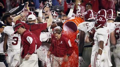 Alabama head coach Nick Saban gets doused after the NCAA college football playoff championship game against Clemson, Monday, Jan. 11, 2016, in Glendale, Ariz. Alabama won 45-40. (Rob Schumacher/The Arizona Republic via AP)