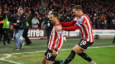 Iliman Ndiaye of Sheffield United celebrates with teammate Billy Sharp after scoring. Getty Images