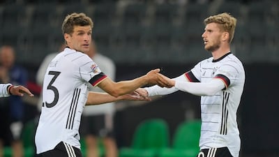 Timo Werner, right, is congratulated by Thomas Muller. AP
