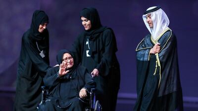 Nadhmiyah Al Abed receives an award from Sheikh Hazza bin Zayed. Victor Besa / The National