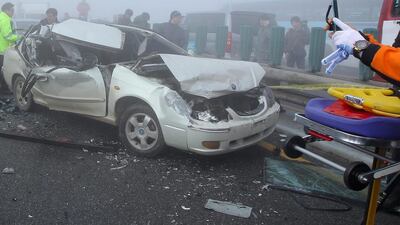Kim Seong-Han, an official from the Incheon Seobu Police Station, said emergency workers have yet to reach all of the damaged cars on the 4,400-metre cross-sea bridge on the motorway from the airport to the capital Seoul. James Park / EPA