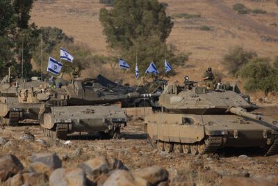 Israeli Merkava tanks were positioned in the upper Galilee in northern Israel near the border with Lebanon on October 11. AFP