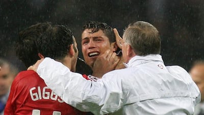 An emotional Cristiano Ronaldo celebrates with Ryan Giggs and Alex Ferguson after the match.