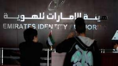 People get their tokens for an ID card at the Emirates Identity Authority registration centre in Al Barsha in Dubai.