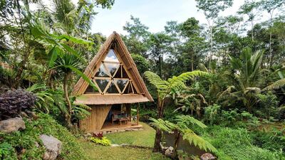 4. Another bamboo home in Bali, The Hideout, provides an eco stay along a river n the mountains of the Gunung Agung volcano.