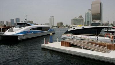 A water taxi, left, is moored next to a Dubai ferry at the Creek’s Al Seef terminal.