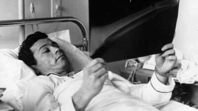 French striker Just Fontaine examines an X-Ray of his fracture in a clinic in Paris after he injured himself during the Reims-Limoges match in 1961. Getty