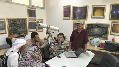 Mohammad Odeh, chairman of the International Astronomy Centre, speaks with his team of experts at the International Astronomy Centre HQ in Al Bateen, Abu Dhabi. International Astronomical Center
