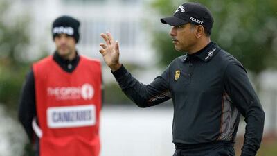 Jeev Milkha Singh reacts to the crowd after putting on the second at Royal Lytham