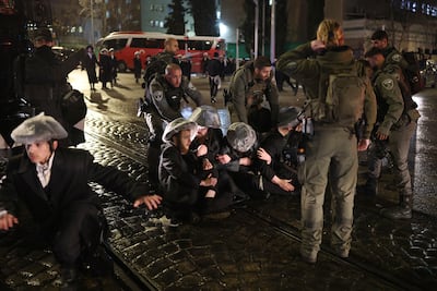 Ultra-Orthodox Jews clash with police during a protest over military recruitment in Jerusalem. EPA