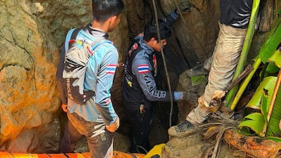 Thai and Laotian rescuers enter a flooded cave in Xaysomboun province, Laos, where seven villagers have been trapped since May 20. EPA