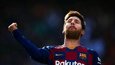 Lionel Messi celebrates after scoring the first of his three-first-half goals against Eibar. EPA