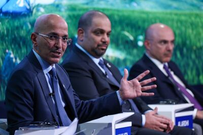 Saudi Arabia's Finance Minister Mohammed Al Jadaan (L) speaks during a panel session with Bahrain's Finance and National Economy Minister Sheikh Salman bin Khalifa and Investcorp executive chairman Mohammed Alardhi (R) on the opening day of the World Economic Forum in Davos. Bloomberg