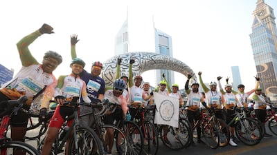 Cyclists take part in the Dubai Ride on Sheikh Zayed Road as part of the Dubai Fitness Challenge 30x30