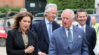 Producer Barbara Broccoli shows Prince Charles onto the set at Pinewood Studios. Getty Images
