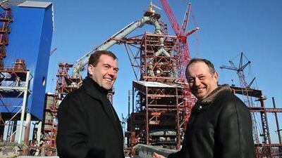 The Russian president Dmitry Medvedev, left, speaks with the Novolipetsk Steel chairman Vladimir Lisin. AP Photo
