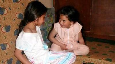 Dalal, 10, left, and Asma, 8, are among thousands of Syrian refugees who have escaped the violence in their country for the northern Lebanese city of Tripoli. Their father says they have not been to school in more than a year.