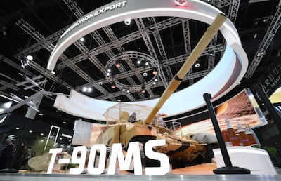 Visitors inspect the Russia pavilion at Idex. On display was the T-90MS ‘Breakthrough’ tank that was upgraded based on Russia's incursion in Ukraine. EPA