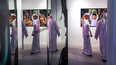 Dhabia AlMansoori’s With This Fruit, I Will Build a Kingdom draws on photographs of her younger brother at Abu Dhabi’s fruit market. Victor Besa / The National
