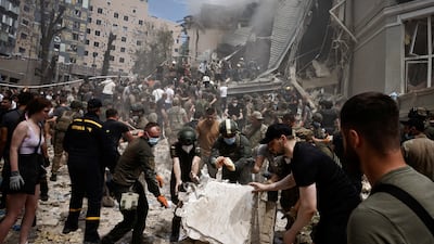Rescuers work at Ohmatdyt children's hospital in Kyiv after it was damaged by Russian missile strikes. Reuters