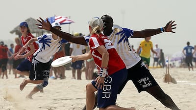 Currier Islands (White) and Great Britain (Red) in action during the 2015 World Championships of Beach Ultimate (WCBU) at the JBR beach in Dubai. Satish Kumar / The National